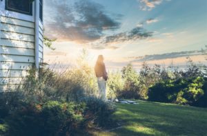 young asian woman with major depressive disorder watching sunrise