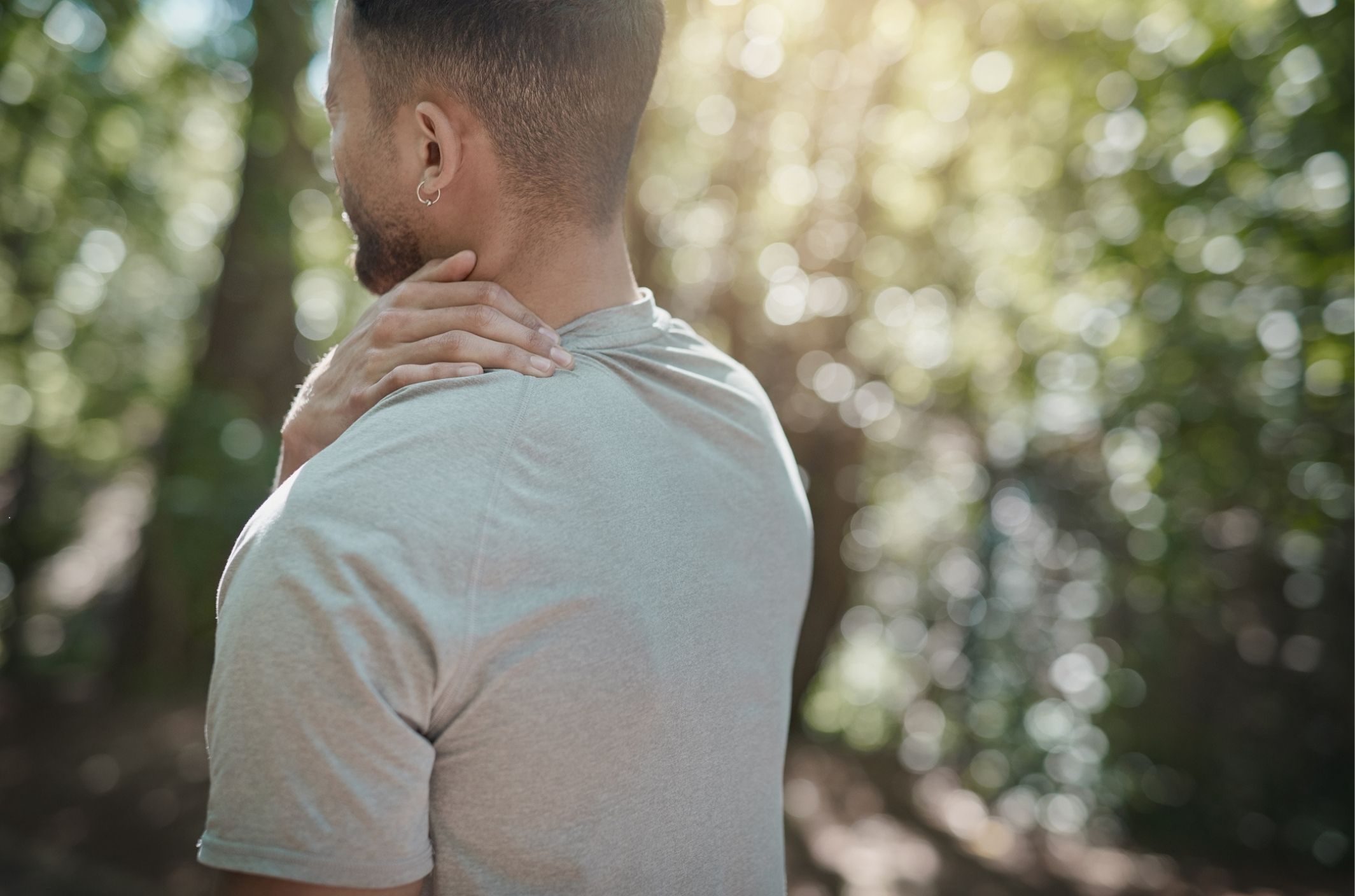 young man outside showing effects of anxiety on the body